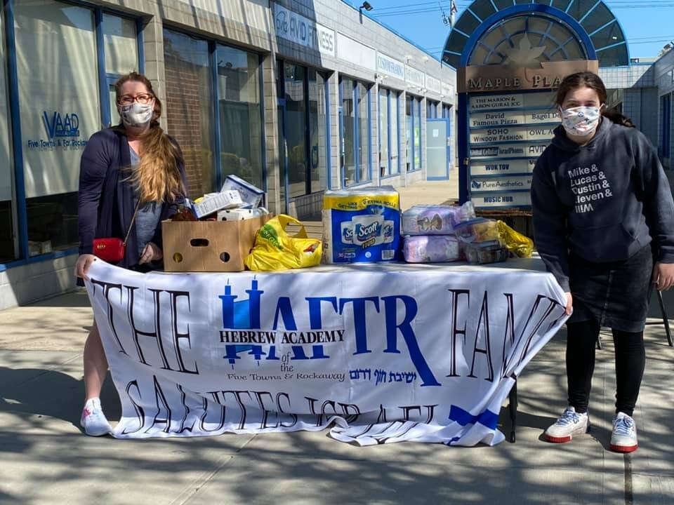 HAFTR students helping with a food drive for the&nbsp;Rina Shkolnik Kosher Food&nbsp;Pantry.