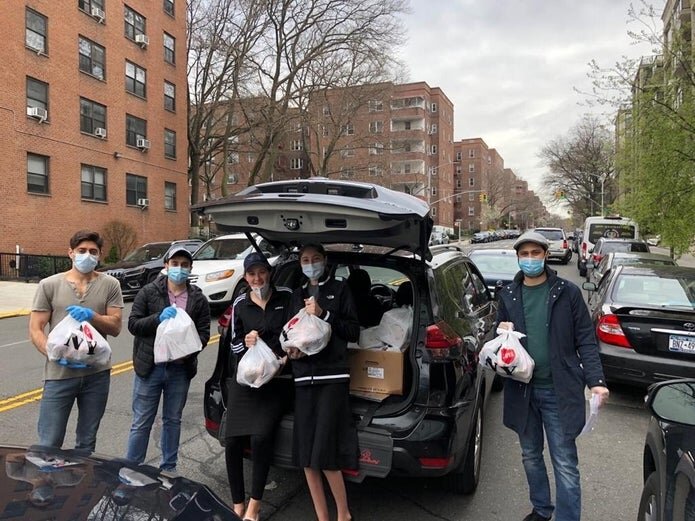 Members of the Queens Jewish Community Council deliver Passover care packages.  (Courtesy of David Aronov/Queens Jewish Community Council)