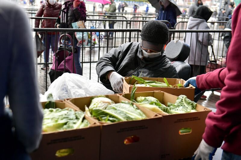 A New Yorker receives a box of food at a Mobile food pantry for New Yorkers Impacted By Covid-19 Pandemic at Barclays Center on April 24, 2020 in Brooklyn. (Michael Loccisano/Getty Images for Food Bank For N)