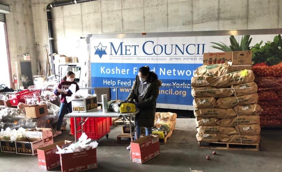 Food distribution continues at a Met Council warehouse. (Photo by Todd Maisel)
