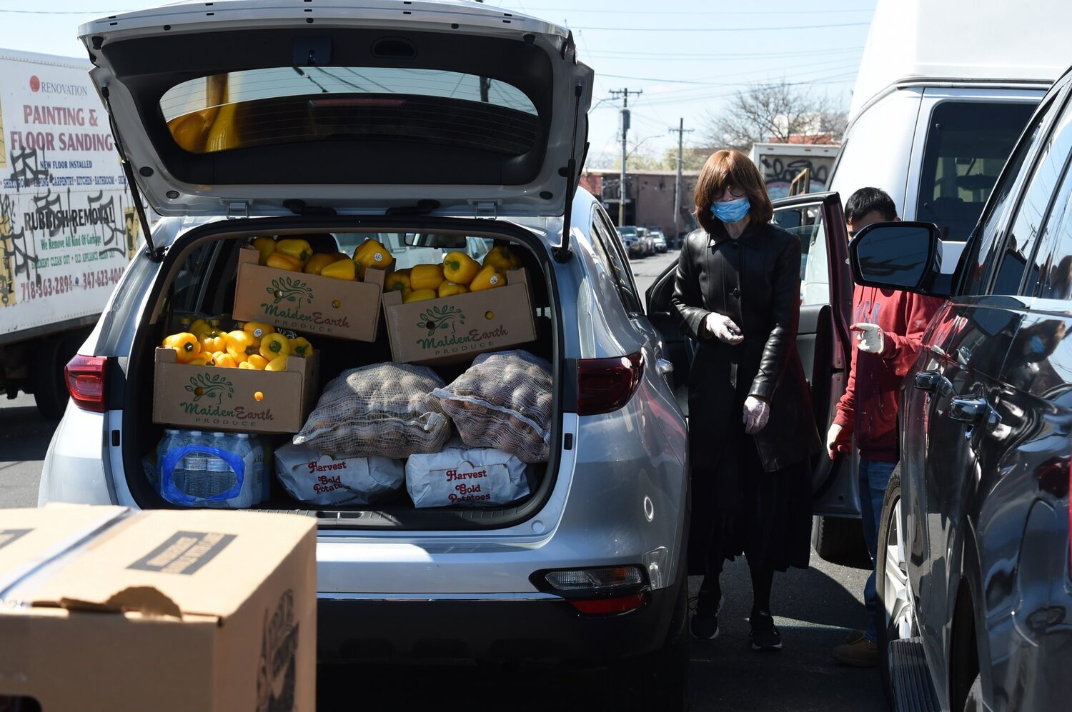 Members of a Crown Heights senior center, load up food for seniors in their center for Passover. (Photo by Todd Maisel)