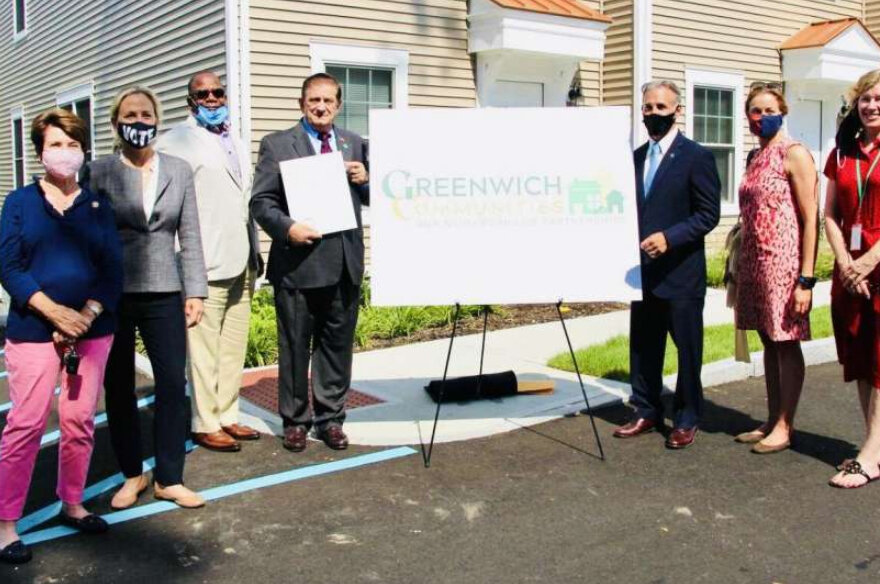 From left, state Rep. Livvy Floren, state Sen. Alex Kasser, Greenwich Communities Executive Director Anthony Johnson, Greenwich Communities Board of Commissioners Chair Sam Romeo, First Selectman Fred Camillo, Selectwoman Jill Oberlander and Selectw…