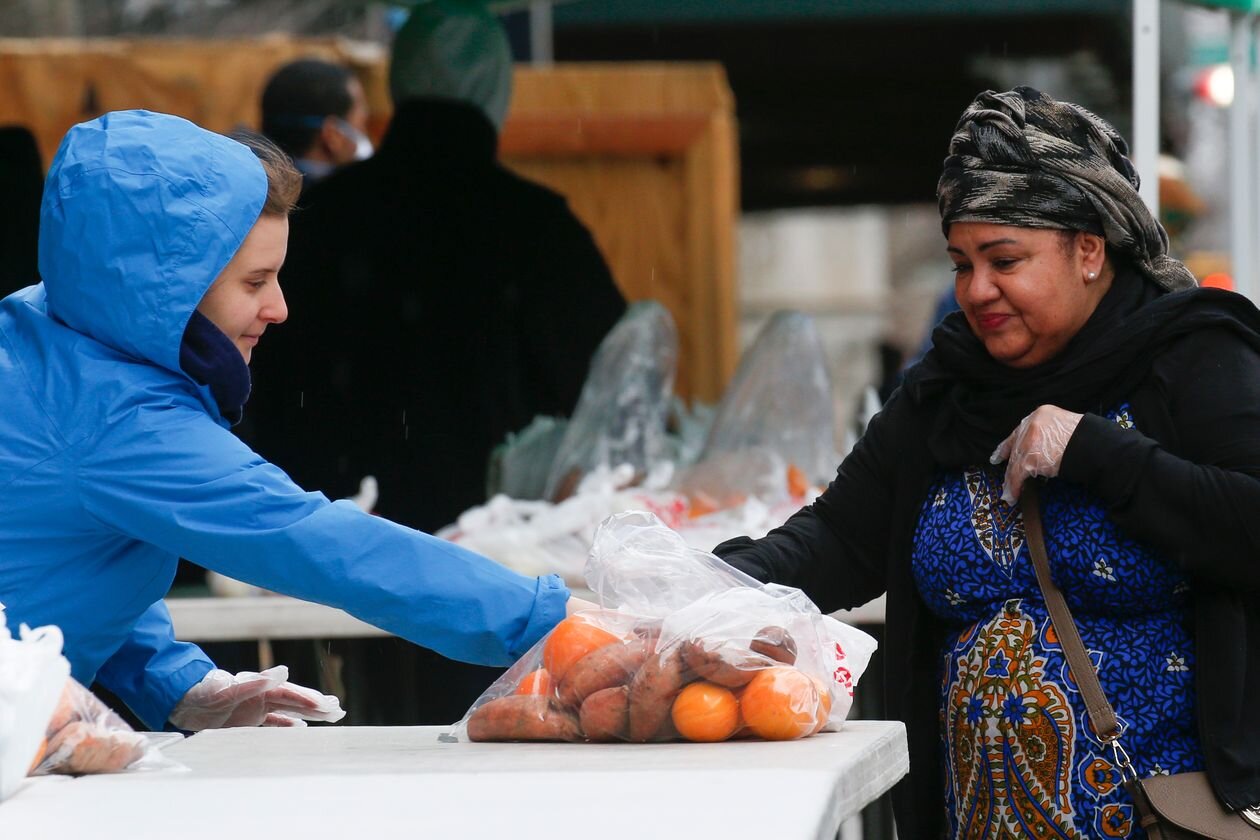 Volunteers from City Harvest distribute food in New York’s Harlem neighborhood in March. PHOTO:&nbsp;KENA BETANCUR/AGENCE FRANCE-PRESSE/GETTY IMAGES