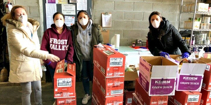 Staff members of the Metropolitan Council’s program assisting victims of domestic abuse are seen organizing a Passover food distribution in New York City. Photo: Metropolitan Council on Jewish Poverty.